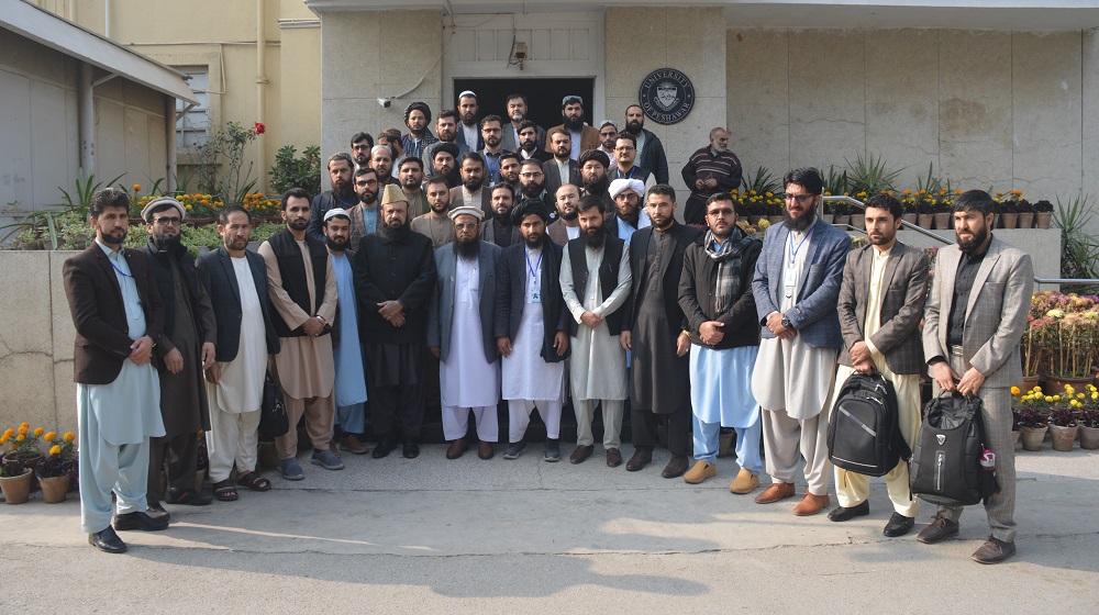 Afghan Education Delegation pose for a group photo with Vice Chancellor Prof. Dr. Muhammad Saleem
