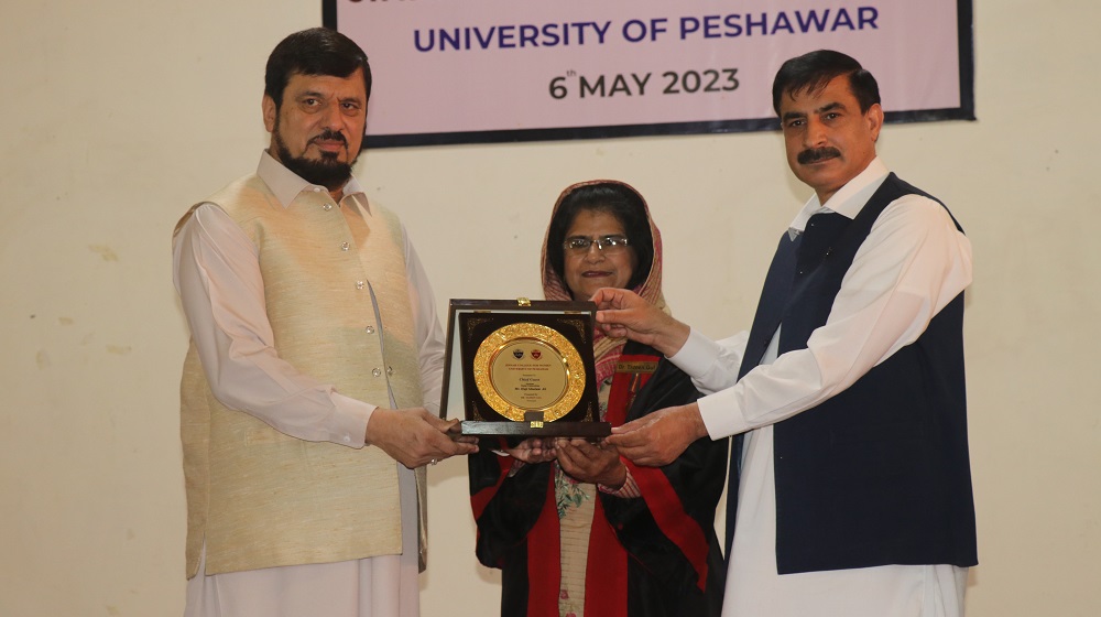 Vice Chancellor Prof. Dr. Muhammad Idrees while accompanied by the principal Jinnah College for Women Prof. Dr. Tazeen Gul presents a souvenir to the Chancellor, Governor KP Haji Ghulam Ali on the eve of 39th Annual Day of JCW.