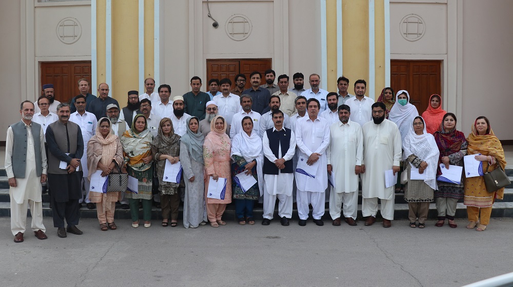 Newly promoted worthy faculty members ( Professors, Associate Professors, Assistant Professors & Lectures) in a group photo with Vice Chancellor Prof Dr Muhammad Idrees.